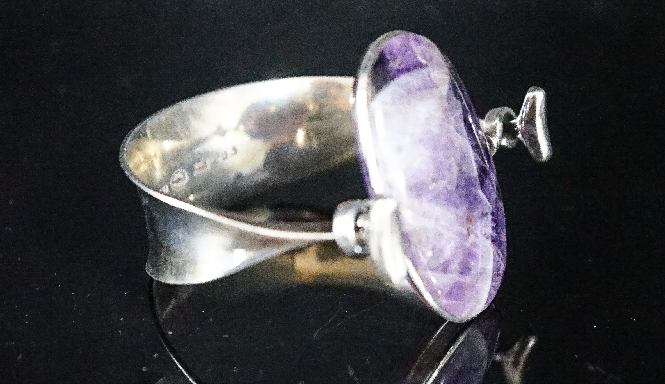 A Vivianna Torun for Georg Jensen sterling and amethyst quartz set openwork bangle, no 203, stone length approx. 43mm.